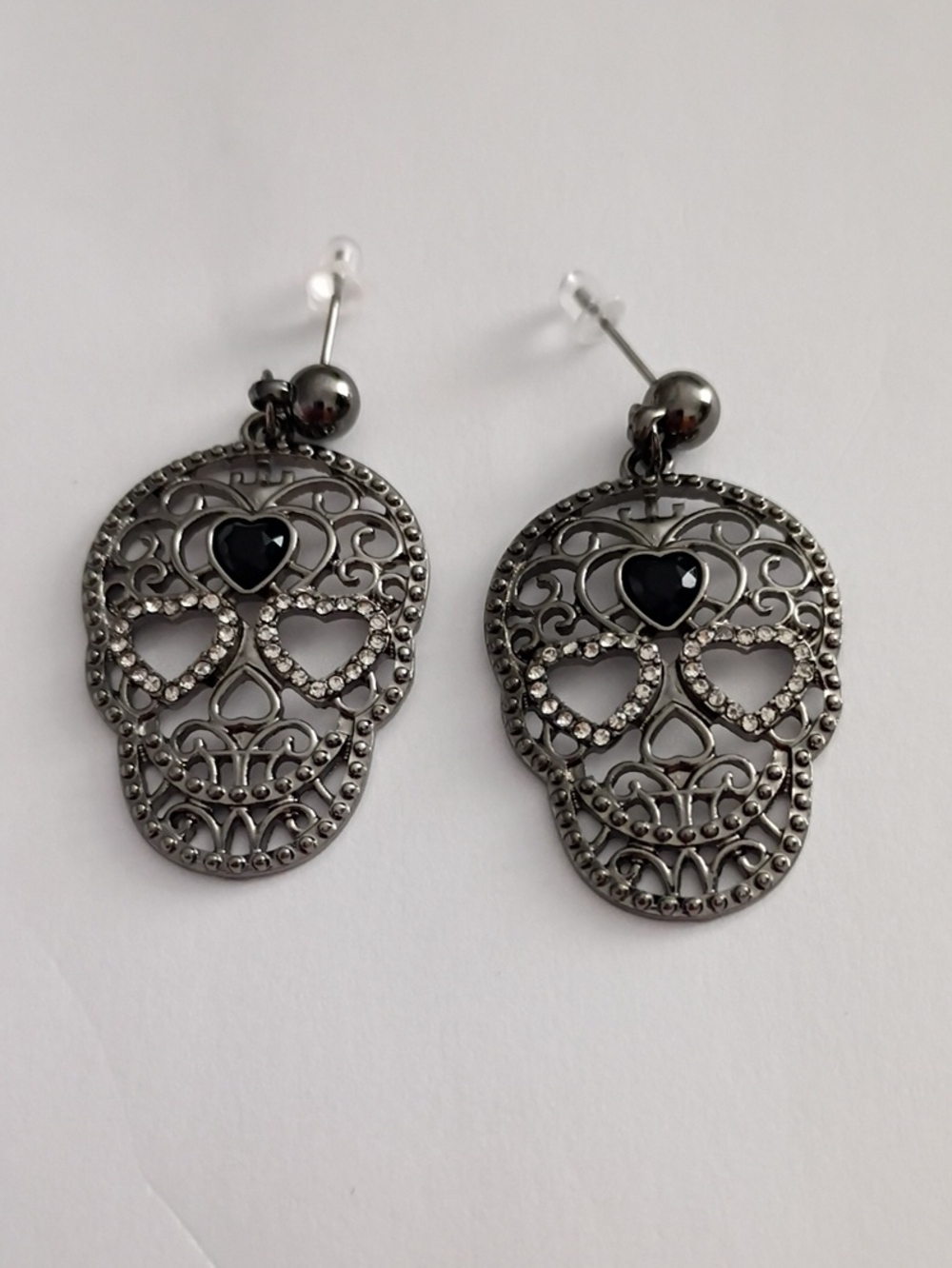 Gunmetal Skull Drop Earrings with Black Heart Accent